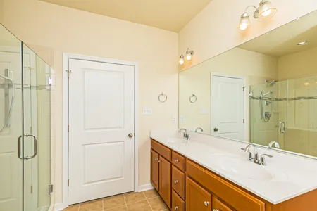 Master bathroom with walk-in shower at Townes at Notting Place: Oak