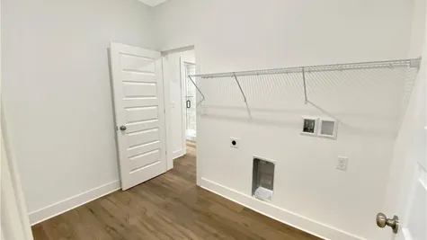 Laundry room connected to primary closet