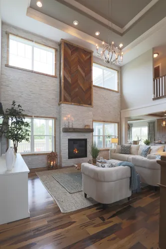 Two-story hearth room in a new home by Tim O'Brien