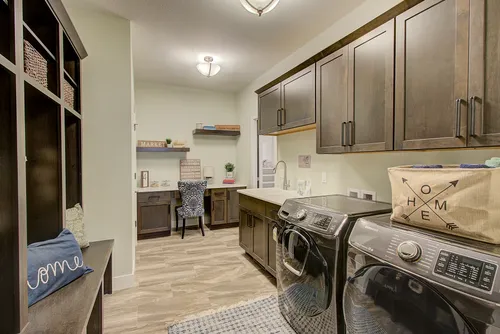 Laundry room and built-in desk in a Wisconsin model home