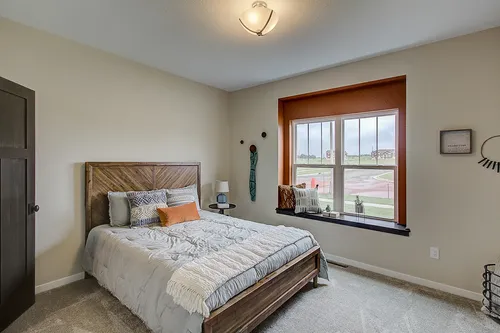 Bedroom with window seat in a new home in Madison WI