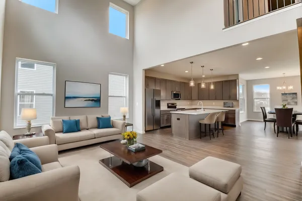 Open Concept Floor Plan with a 2 Story Great Room Featuring a Wall of Windows