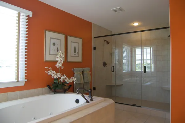 bathroom with orange walls in a new delaware home