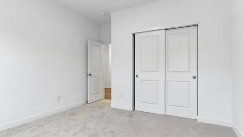 Guest bedroom in the Chestnut, Abbey Commons