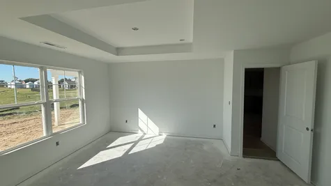 Primary bedroom with single step ceiling, the Bradford Floor Plan at Westfall Place