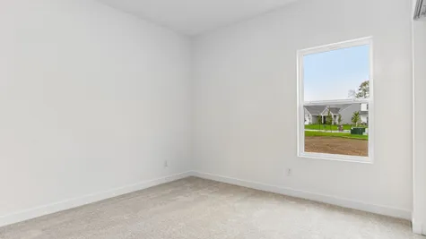 Guest bedroom in the Chestnut, Abbey Commons