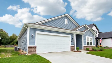 Chestnut by Arbor Homes exterior with blue siding and brick