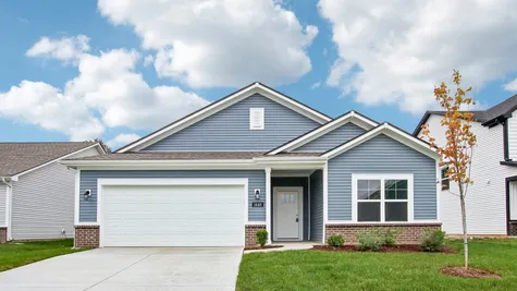 Chestnut by Arbor Homes exterior with blue siding and brick