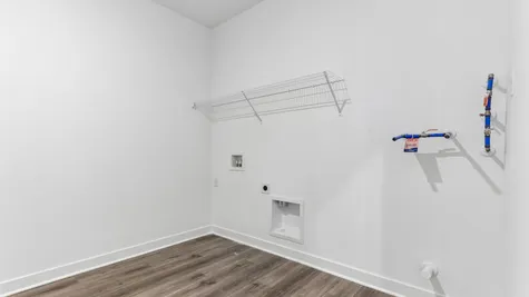 Laundry room with shelving, Abbey Commons