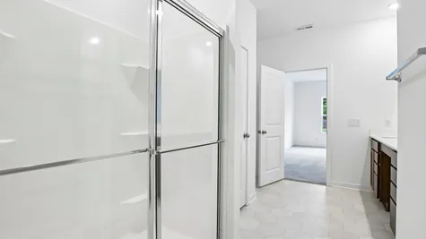 Walk-in shower in the primary bathroom of the Chestnut by Arbor Homes