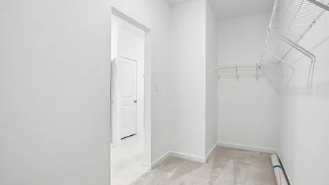 Walk-in closet in the primary bathroom of the Chestnut by Arbor Homes