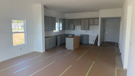 Kitchen with grey cabinets, the Bradford Floor Plan at Westfall Place