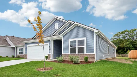 Chestnut by Arbor Homes exterior with blue siding and brick