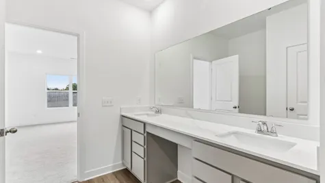 Primary bathroom with dual sinks and quartz countertops, Abbey Commons